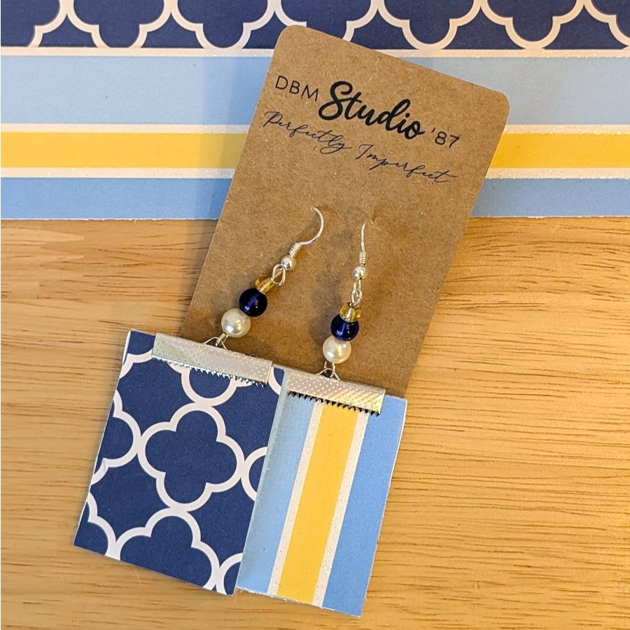 Blue Square Paper and felt earrings in silver tone with blue and silver. Back side dark blue and white clover-ish design, front side is light blue, yellow and white striped.